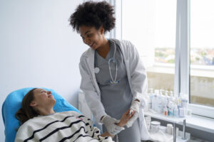Female Respiratory Therapist taking care of a patient