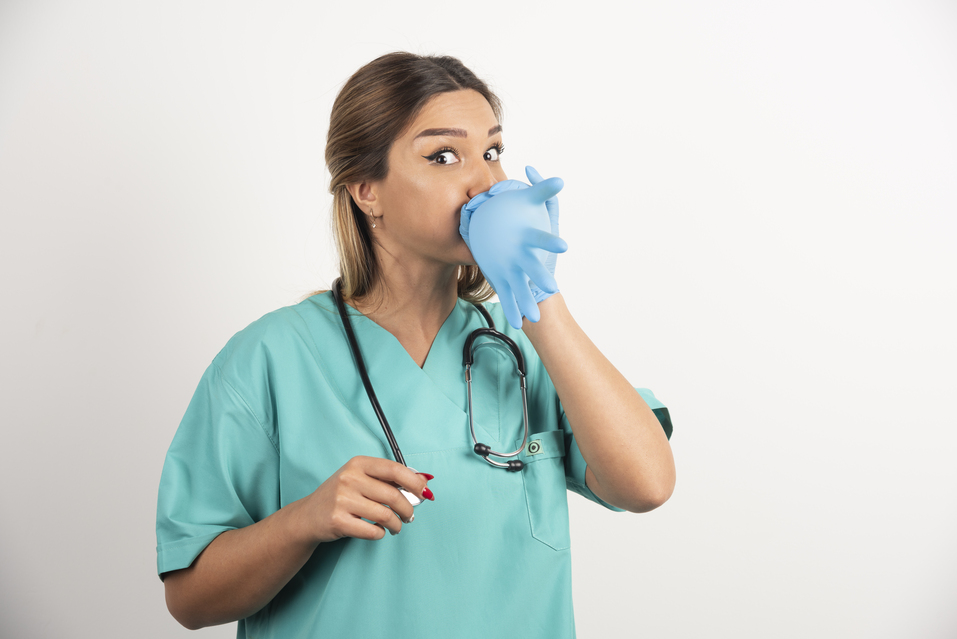 Respiratory Therapist closing her nose